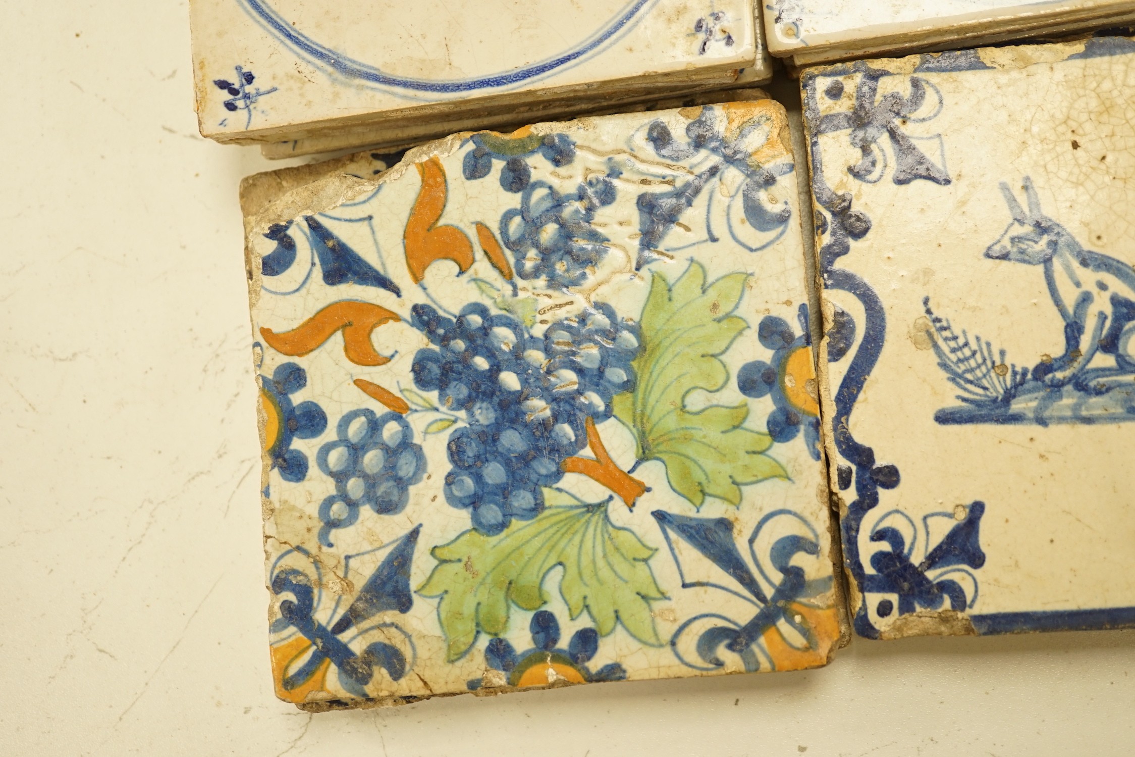 Four 18th century Delft tiles and nine 19th-century Delft blue and white animal tiles(13)